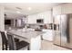Modern kitchen featuring stainless steel appliances, white cabinets, and a gray granite countertop at 4132 Festival Pointe Blvd, Mulberry, FL 33860
