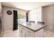 Spacious kitchen island with bar stool seating and sliding glass doors to the outside at 4132 Festival Pointe Blvd, Mulberry, FL 33860