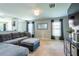 Comfortable living room featuring neutral tones, large windows, and stylish furnishings at 4132 Festival Pointe Blvd, Mulberry, FL 33860