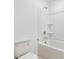 Bathroom with tile walls, shower, and toilet at 4732 Babys Breath Pl, Kissimmee, FL 34758