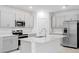Modern kitchen with an island, gray cabinets, and stainless steel appliances at 4732 Babys Breath Pl, Kissimmee, FL 34758