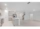 Modern kitchen with an island, gray cabinets, and stainless steel appliances at 4732 Babys Breath Pl, Kissimmee, FL 34758