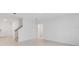 Open living room showcasing neutral walls and staircase at 4732 Babys Breath Pl, Kissimmee, FL 34758