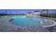 Community pool featuring zero entry, splash pad, and seating for residents to enjoy the Florida sun at 4732 Babys Breath Pl, Kissimmee, FL 34758