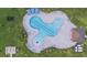 Aerial view of a uniquely shaped community pool with lounge seating and shaded areas for residents to enjoy at 4732 Babys Breath Pl, Kissimmee, FL 34758