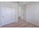 Bright bedroom features a double door closet and neutral carpet at 16398 Yelloweyed Dr, Clermont, FL 34714