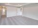 Expansive living room with plush carpeting at 16398 Yelloweyed Dr, Clermont, FL 34714