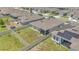 Aerial view of a property highlighting the fenced-in backyard with a screened-in porch at 2359 White Cedar Way, Haines City, FL 33844