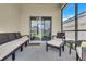 Inviting screened patio with comfortable seating, perfect for relaxing and enjoying the outdoors at 2359 White Cedar Way, Haines City, FL 33844