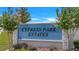 Community entrance sign for Cypress Park Estates with lush landscaping at 2359 White Cedar Way, Haines City, FL 33844