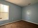 Bedroom featuring a neutral color scheme, and a window with blinds at 103 Thornbush Pkwy, Davenport, FL 33837