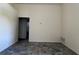 Neutral living room with tile flooring leading to doorway and view to other rooms at 103 Thornbush Pkwy, Davenport, FL 33837