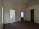 Bright main bedroom featuring doors to closet, hall and attached bathroom at 103 Thornbush Pkwy, Davenport, FL 33837