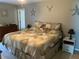Relaxing bedroom featuring neutral tones, a comfortable bed, and tasteful decor at 110 N Chester St, Leesburg, FL 34748