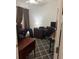 A functional home office space with ample desk area and dark wood furnishings at 1634 Plumeria Pl, Oviedo, FL 32765