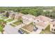 Aerial view of houses in a suburban neighborhood featuring two-story homes with attached garages at 16828 N Gold Star Ct, Clermont, FL 34714