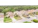 Beautiful two-story homes with well-manicured lawns and attached garages line a quiet suburban street at 16828 N Gold Star Ct, Clermont, FL 34714