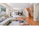 Bright living room with an open floor plan, featuring modern furnishings and access to the updated kitchen at 16828 N Gold Star Ct, Clermont, FL 34714