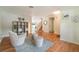 Spacious open-concept living area with hardwood floors, stylish furniture, and abundant natural light at 16828 N Gold Star Ct, Clermont, FL 34714