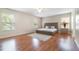 Spacious main bedroom with hardwood floors and modern furniture at 16828 N Gold Star Ct, Clermont, FL 34714