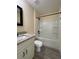 Bathroom boasting granite counters, modern fixtures, and a shower-tub combination with a white surround at 16910 Sw 27 Avenue, Ocala, FL 34473