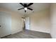 Inviting bedroom with ceiling fan and access to a closet and the rest of the home at 16910 Sw 27 Avenue, Ocala, FL 34473