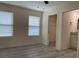 Comfortable bedroom with windows, a ceiling fan, and easy access to a closet and bathroom at 16910 Sw 27 Avenue, Ocala, FL 34473