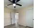Bedroom view showcasing natural light and a ceiling fan, connecting the room to other living spaces at 16910 Sw 27 Avenue, Ocala, FL 34473