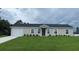 Charming single-story home with a well-maintained lawn, a one-car garage, and a welcoming front entrance at 16910 Sw 27 Avenue, Ocala, FL 34473