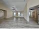 Spacious living room with open layout, ceiling fan, and views into adjacent rooms, creating a welcoming atmosphere at 16910 Sw 27 Avenue, Ocala, FL 34473