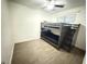 Bedroom with bunk beds, ceiling fan, and wood-look tile flooring at 4662 Tiffany Woods Cir, Oviedo, FL 32765