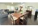 Open-concept living and dining area with dark hardwood floors, lots of space, and neutral color palette at 4662 Tiffany Woods Cir, Oviedo, FL 32765