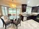 Updated eat-in kitchen with granite countertops, stainless steel appliances, and a charming chandelier at 4662 Tiffany Woods Cir, Oviedo, FL 32765