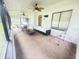 Spacious screened patio with ceiling fans, outdoor seating, and a view of the backyard at 4662 Tiffany Woods Cir, Oviedo, FL 32765