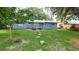 Spacious backyard with patio, chairs, and stepping stones leading to the house at 5834 Forest Grove Blvd, Orlando, FL 32808