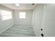 Bright bedroom with new floors, fresh paint, and two bright windows at 5834 Forest Grove Blvd, Orlando, FL 32808