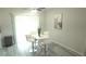 Cozy dining area featuring modern white furniture, neutral decor, and lots of natural light at 5834 Forest Grove Blvd, Orlando, FL 32808