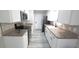 Modern kitchen featuring white cabinets, granite counters, stainless steel appliances, and stylish backsplash at 5834 Forest Grove Blvd, Orlando, FL 32808
