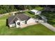 Aerial view of a lovely home with a spacious yard and separate garage/workshop at 33632 Wesley Rd, Eustis, FL 32736