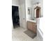 Bathroom featuring a vanity with drawers, toilet room, and walk in closet at 33632 Wesley Rd, Eustis, FL 32736