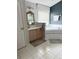 Bright bathroom showcasing a soaking tub, vanity, and tile flooring at 33632 Wesley Rd, Eustis, FL 32736
