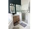 Bathroom featuring a glass shower with a white marble surround and a wooden vanity sink at 33632 Wesley Rd, Eustis, FL 32736