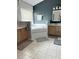 Bright bathroom features a soaking tub with a white tile surround and double sink vanities at 33632 Wesley Rd, Eustis, FL 32736