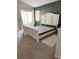 Bedroom with neutral decor, sliding glass doors to patio at 33632 Wesley Rd, Eustis, FL 32736