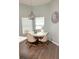 Cozy breakfast nook with modern chandelier and views from the window at 33632 Wesley Rd, Eustis, FL 32736