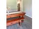 Dining area with wooden table and bench seating, adjacent to kitchen at 33632 Wesley Rd, Eustis, FL 32736