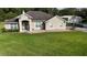 Charming single-story home with a well-manicured lawn and neutral-toned exterior at 33632 Wesley Rd, Eustis, FL 32736