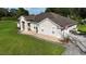 Beautiful home exterior with a well-kept lawn and walkway leading to the front door at 33632 Wesley Rd, Eustis, FL 32736