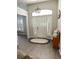 Inviting foyer with decorative rug, bench seating, and natural light at 33632 Wesley Rd, Eustis, FL 32736
