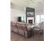 Comfortable living room featuring a fireplace, vaulted ceiling, and stylish decor at 33632 Wesley Rd, Eustis, FL 32736